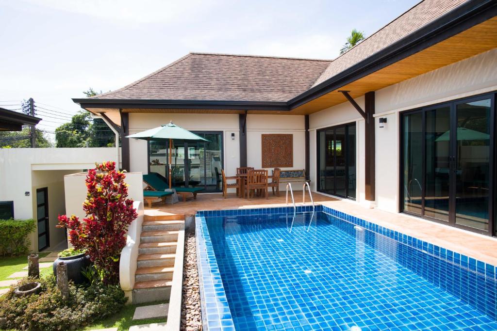 Exterior view of a private pool at Foxtail Palm Villa in Rawai Beach